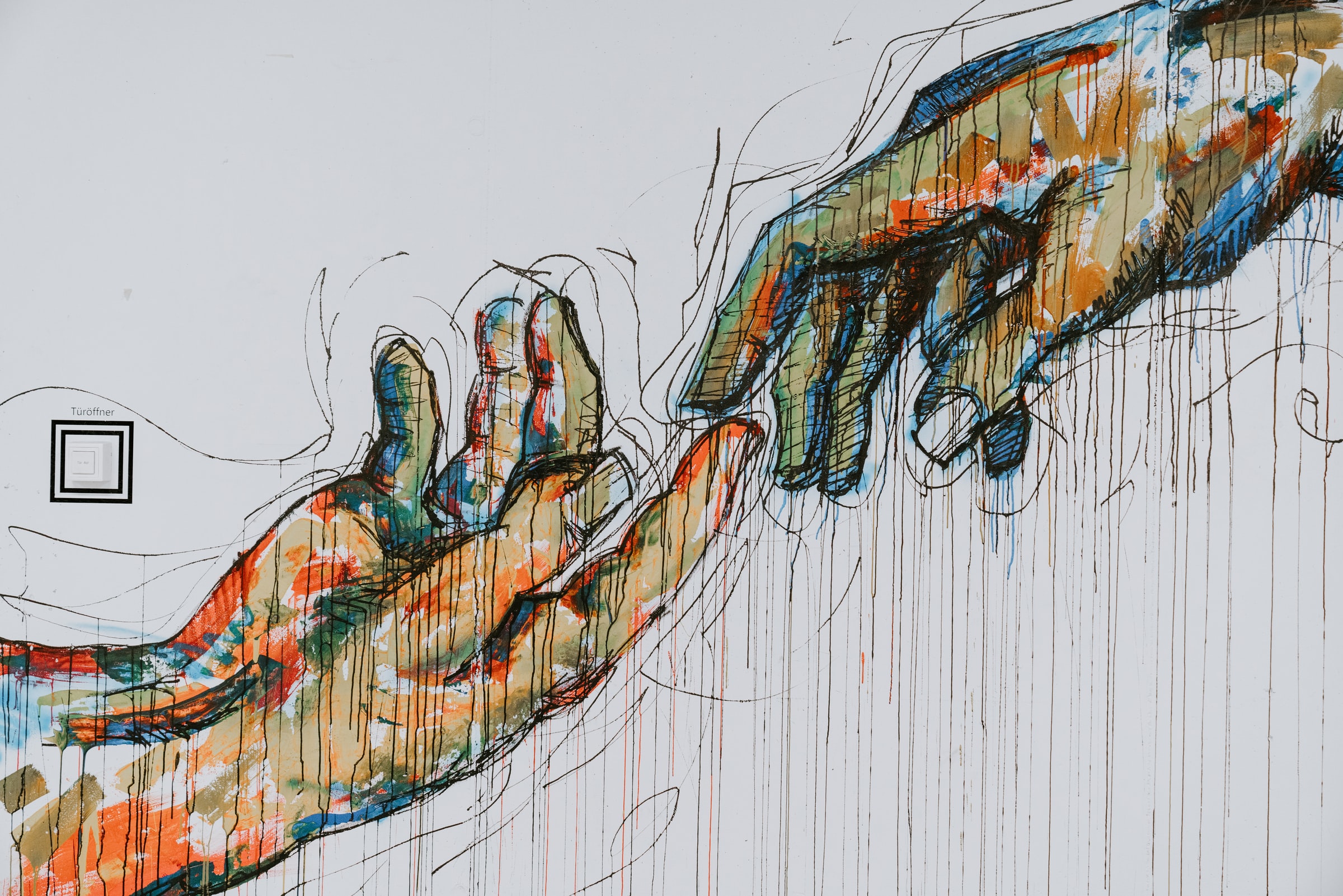 artistic depiction of hands touching